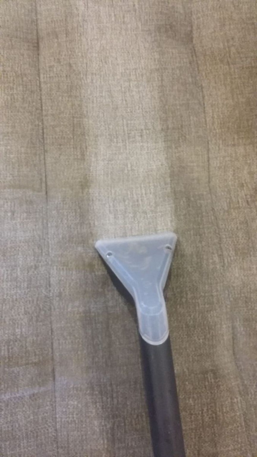 Extraction wand on upholstery fabric